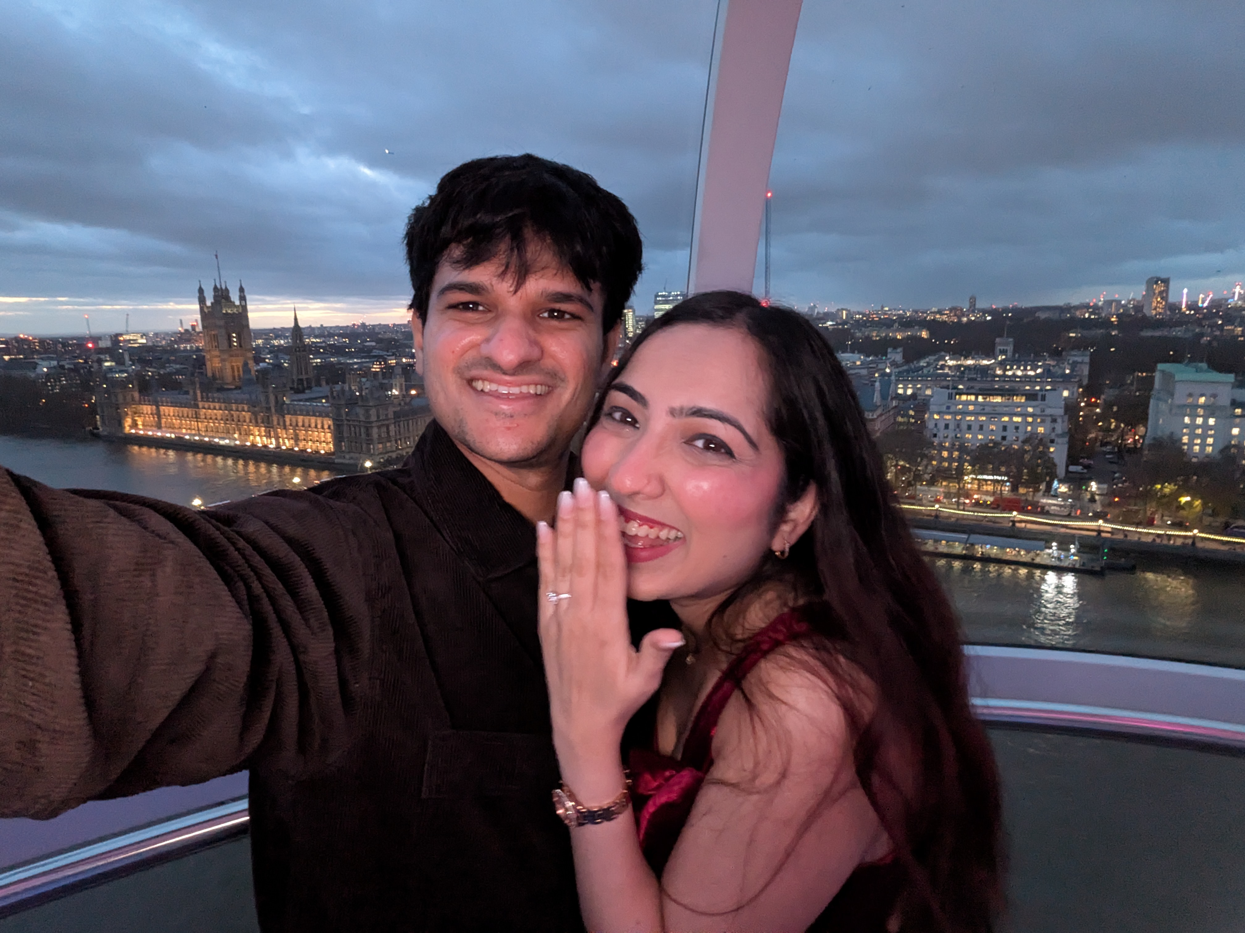 Smiling with ring and hand over mouth